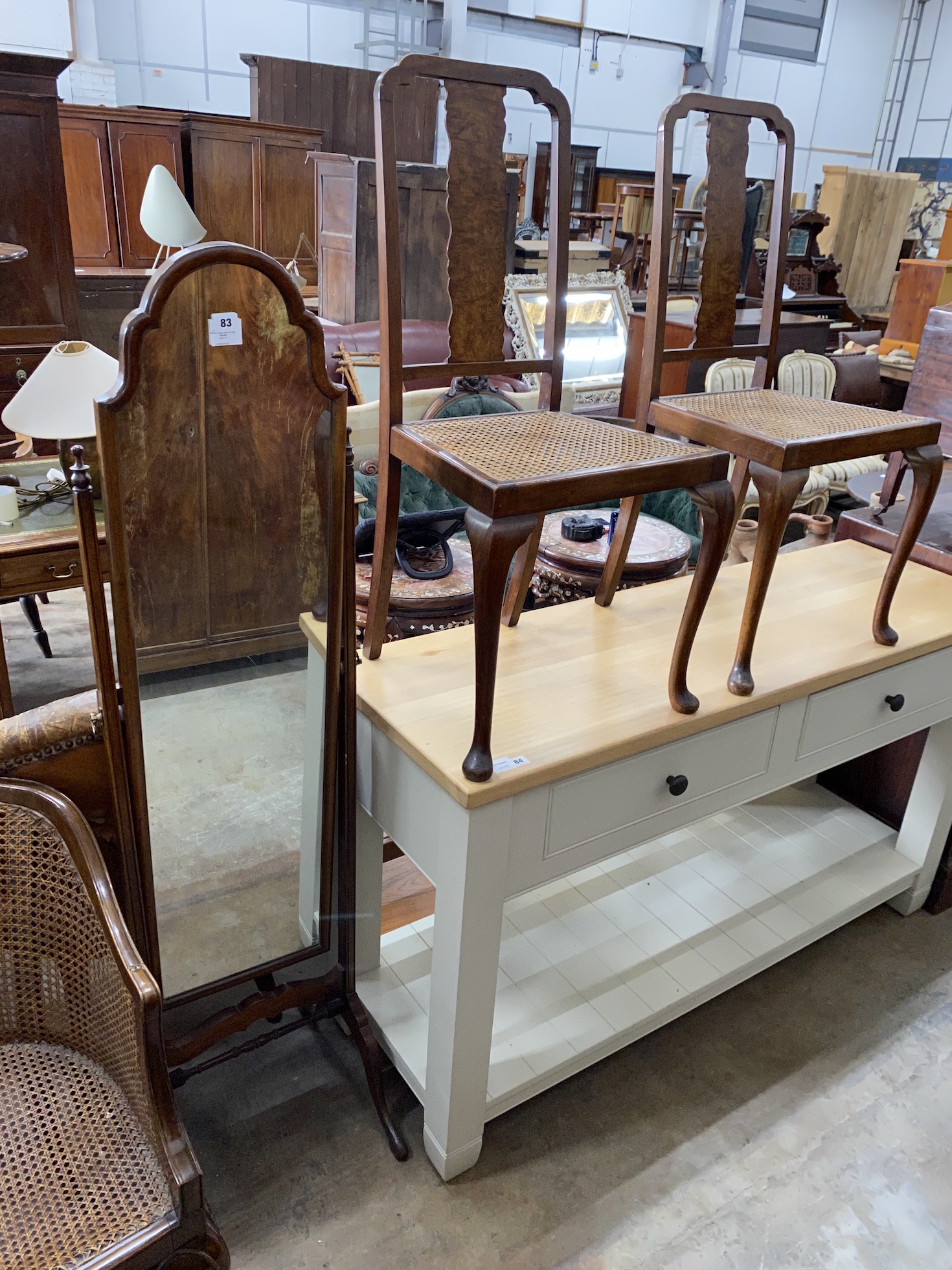 A Queen Anne revival walnut cheval mirror, width 39cm, depth 45cm, height 159cm and a pair of cane seat side chairs